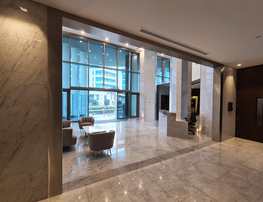 Elegant master bedroom with natural light and contemporary design at Ajwan Towers, Abu Dhabi.